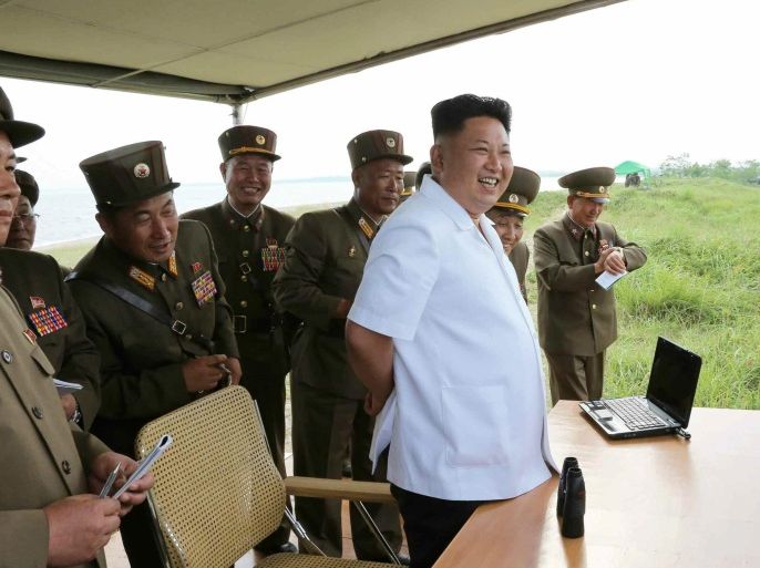 A picture released by the Rodong Sinmun, the newspaper of the ruling North Korean Workers Party, on 27 June 2014 shows North Korean leader Kim Jong-un observing the test-fire of a newly developed tactical guided missile at an undisclosed location in North Korea. North Korea fired three rockets into the sea east of the Korean peninsula, South Korea's Defence Ministry said on 26 June 2014. The rockets landed in international waters, Yonhap news agency quoted an unnamed military official as saying. EPA/Rodong Sinmun