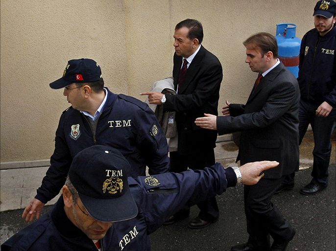 epa03405597 (FILE) A file picture dated 25 February 2012 shows Turkey's former top Navy Commander Ozden Ornek (centre, background) as he is escorted by police upon arrival at court in Istanbul, Turkey. Three retired generals, Ibrahim Firtina, Ozden Ornek and Cetin Dogan, were sentenced to 20 years each in jail by a Turkish court 21 September 2012 for being part of a planned coup against the government, national media reported. More than 360 active and retired officers face charges before the court in Silivri, north-west of Istanbul. They stand accused of laying plans in 2003 to throw the country into chaos, creating the conditions for the military to lead a coup. EPA/TOLGA BOZOGLU