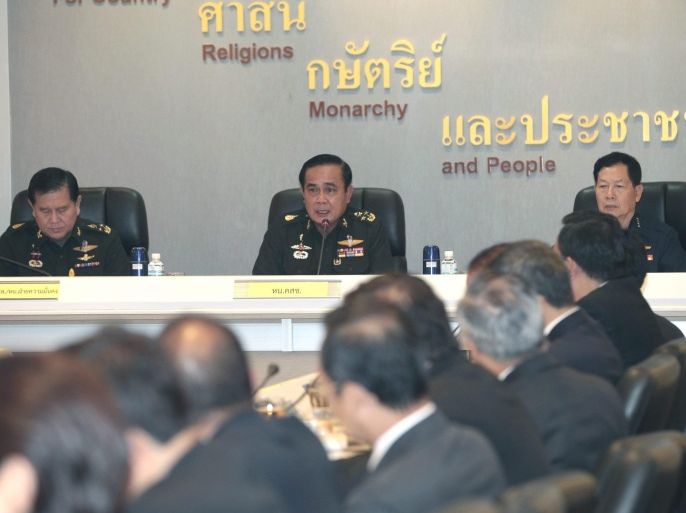 Thai army chief and junta head General Prayuth Chan-ocha (C) talks during a meeting regarding the national situation at the Royal Thai Army headquarters in Bangkok, Thailand, 11 June 2014. Chan-ocha held a meeting with Thai ambassadors and consuls-general deployed in 21 countries to clarify the Thai situation abroad, after the military coup on 22 May 2014.