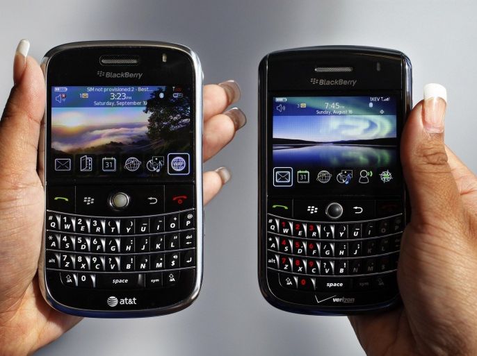 In this Monday, Sept. 21, 2009, file photo, a BlackBerry Bold, left, and Tour, right are photographed in Mountain View, Calif., Monday, Sept. 21, 2009.Troubled smartphone maker BlackBerry has won an early round in its legal battle against an iPhone keyboard made by a startup co-founded by "American Idol" host Ryan Seacrest. (AP Photo/Paul Sakuma, File)