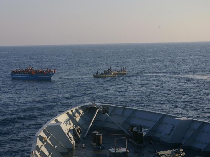 A handout picture provided by the Italian Navy Press Office shows North African immigrants in their boat as they are being rescued off the coast of Sicily, southern Italy, 11 April 2014. The Italian navy rescued 800 North African immigrants off the coast of Libya late 10 April in the latest in a string of pick-ups off rickety boats that have been launched like flotillas during the recent spell of warm weather. The migrants were on board seven rust-buckets and large dinghies that were intercepted by four Navy frigates and a Finance Guard motorboat about 70 nautical miles south of the stepping-stone Italian island of Lampedusa, which is closer to Libya than to Sicily. Earlier this week Italy issued a fresh call for help from the European Union after rescuing more than 4,000 migrants in 48 hours. EPA/ITALIAN NAVY PRESS OFFICE / HANDOUT