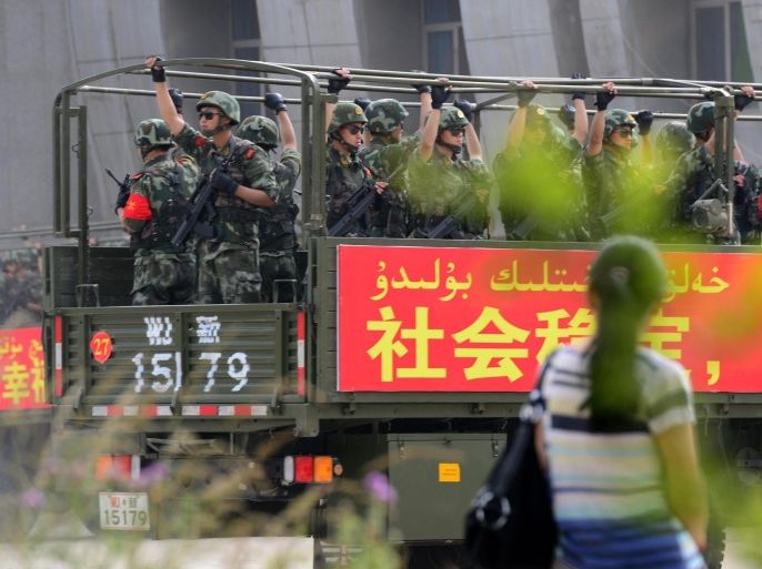 This picture taken on June 6, 2014 shows security forces participating in a military drill in Hetian, northwest China's Xinjiang region.China vowed a year-long campaign against terrorism, days after attackers in the western region of Xinjiang killed 39 people in a suicide raid. The statement said the campaign would last until June 2015 and is aimed at 'preventing the spread of religious extremism' from Xinjiang to the country's interior. CHINA OUT AFP PHOTO