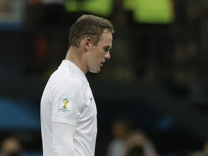 England's Wayne Rooney leaves the pitch after the group D World Cup soccer match between England and Italy at the Arena da Amazonia in Manaus, Brazil, Saturday, June 14, 2014. Italy won the match 2-1. (AP Photo/Matt Dunham)