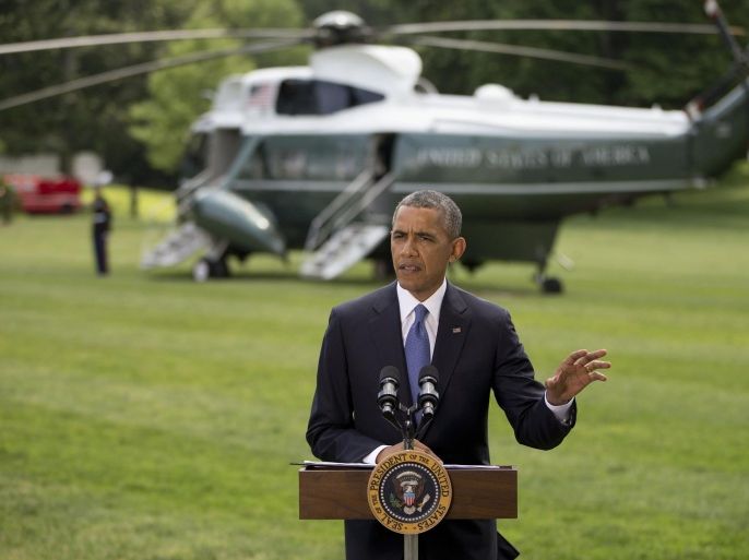 President Barack Obama talks about his administration's response to a growing insurgency foothold in Iraq, Friday, June 13, 2014, on the South Lawn of the White House in Washington, prior to boarding the Marine One Helicopter for Andrews Air Force Base, Md., then onto North Dakota and California. (AP Photo/Pablo Martinez Monsivais)
