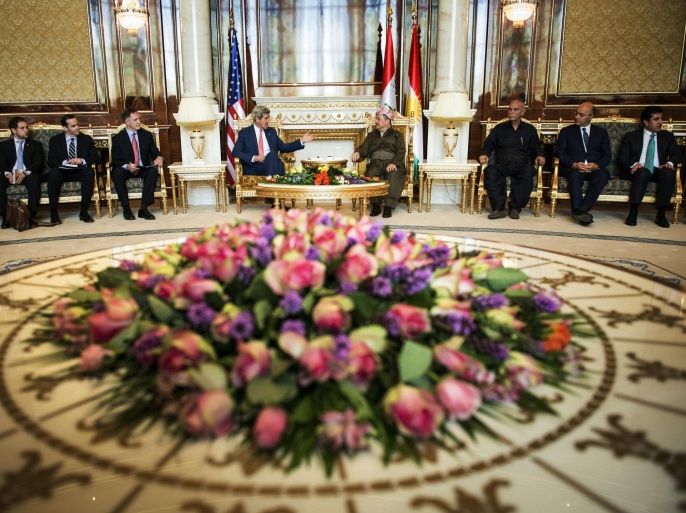 Kurdish regional President Massoud Barzani, center right, listens to U.S. Secretary of State John Kerry, center left, during a meeting at the presidential palace in Irbil, Iraq, Tuesday, June 24, 2014. Kerry arrived in Iraq's Kurdish region in a US diplomatic drive aimed at preventing the country from splitting apart in the face of militants pushing towards Baghdad. (AP Photo/Brendan Smialowski, Pool)