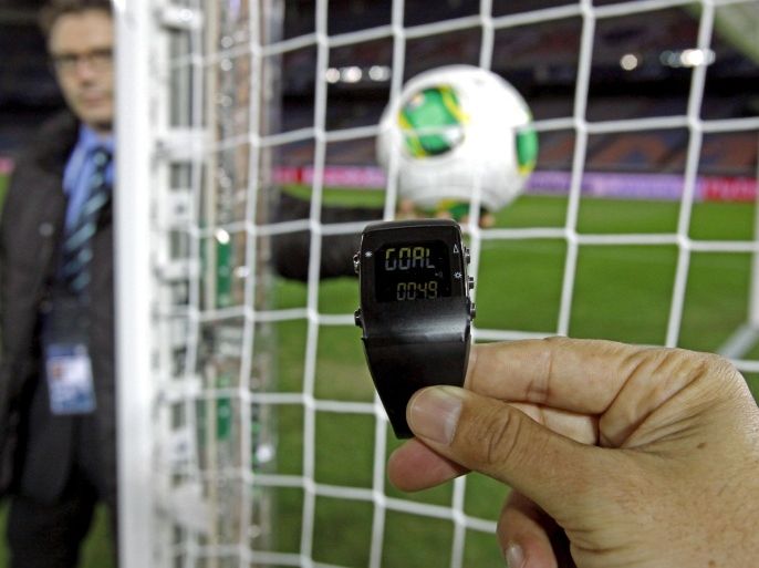 FILE - In this Wednesday, Dec. 5, 2012, file photo, the goal-line monitoring device is demonstrated before the media at Yokohama Stadium in Yokohama, near Tokyo. For the first time at a World Cup, technology will be used to determine whether a ball crosses the goal line during matches at the upcoming tournament in Brazil. With vanishing spray also being used to prevent encroachment by defenders making up a wall during free kicks, officials at the highest level of the world’s most popular sport are finally getting some assistance. (AP Photo/Shuji Kajiyama, File)