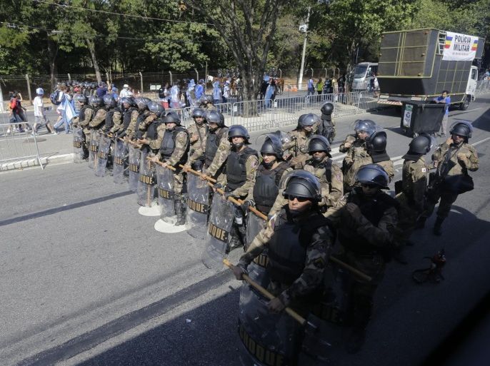 Military police secure the area around the Mineirao Stadium before the group F World Cup soccer match between Argentina and Iran in Belo Horizonte, Brazil, Saturday, June 21, 2014. (AP Photo/Sergei Grits)