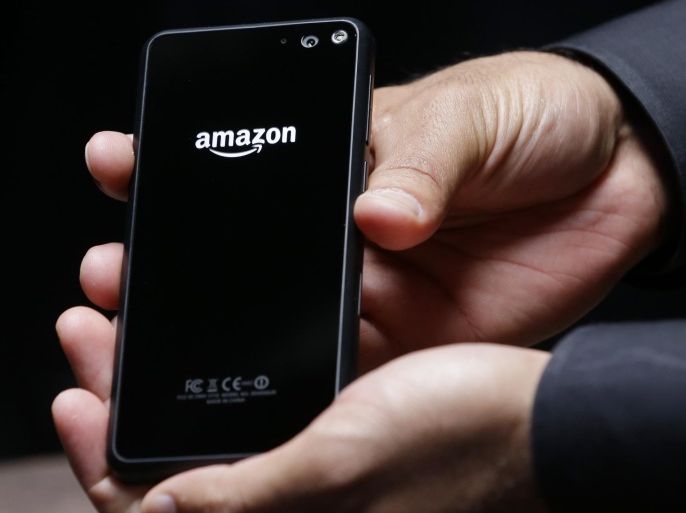 The back of the new Amazon Fire Phone is displayed for cameras after the official launch event, Wednesday, June 18, 2014, in Seattle. (AP Photo/Ted S. Warren)