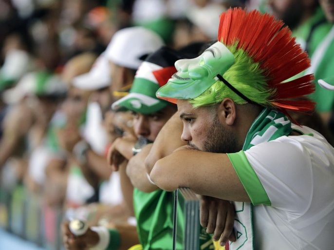 Fans of Algeria react after their team lost 2-1 the group H World Cup soccer match between Belgium and Algeria at the Mineirao Stadium in Belo Horizonte, Brazil, Tuesday, June 17, 2014. (AP Photo/Sergei Grits)
