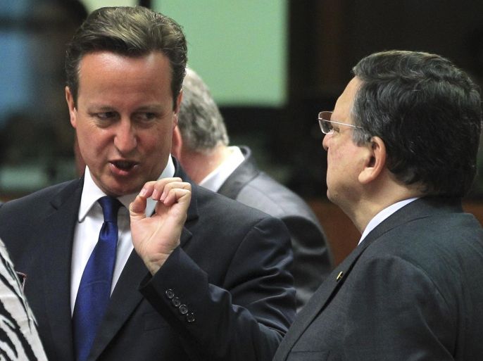 European Commission President Jose Manuel Barroso, right, talks with British Prime Minister David Cameron, during an EU Summit meeting in Brussels on Friday, June 27, 2014. European Union leaders are set to nominate former Luxembourg Prime Minister Jean-Claude Juncker to become the 28-nation bloc’s new chief executive despite strong British opposition. The leaders at their summit Friday in Brusssels planned to elect Juncker with overwhelming majority as the candidate they will propose to the European Parliament. (AP Photo/Yves Logghe)