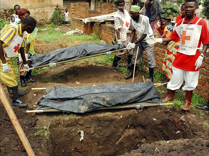 Congolese Red Cross members bury the bodies of two UPC-soldiers Tuesday, June 17, 2003 in the eastern town of Bunia in the Democratic Republic of Congo that killed in a firefight with french troops of multinational UN-forces. The United Nation says 500 civilians have been massacred in interethnic fighting in and around the town in the past month and 50000 have benn killed since 1999. EPA