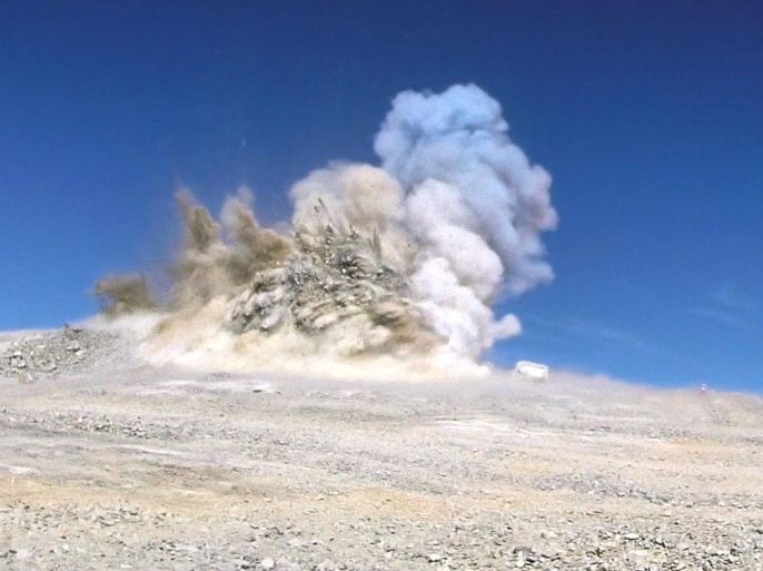 A handout photo provided by the European Southern Observatory ESO on 19 June 2014 shows the first detonation removing about 5,000 cubic meters in a series of blastings aimed at removing a total of 220,000 cubic metres of rock for the 300 x 150 metres platform on peak of the Cerro Armazones mountain in Chile. A groundbreaking ceremony took place 19 June to mark the next major milestone towards the construction of ESO's European Extremely Large Telescope (E-ELT). Part of the 3000-metre peak of Cerro Armazones were blasted away in order to levelling the summit in preparation for the construction of the largest optical/infrared telescope in the world. EPA/ESO/European Southern Observatory/HANDOUT