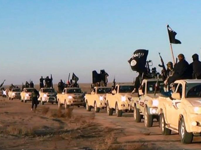FILE - This file image posted on a militant website on Tuesday, Jan. 7, 2014, which is consistent with AP reporting, shows a convoy of vehicles and fighters from the al-Qaida-linked Islamic State of Iraq and the Levant (ISIL) fighters in Iraq's Anbar Province. The Islamic State was originally al-Qaida's branch in Iraq, but it used Syria's civil war to vault into something more powerful. It defied orders from al-Qaida's central command and expanded its operations into Syria, ostensibly to fight to topple Assad. But it has turned mainly to conquering territory for itself, often battling other rebels who stand in the way. (AP Photo/militant website, File)