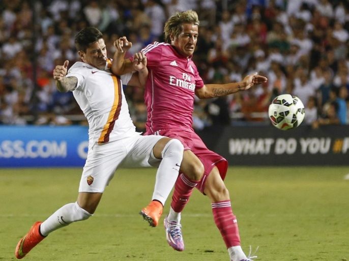 Jul 29, 2014; Dallas, TX, USA; Real Madrid defender Fabio Coentrao battles for the ball with AS Roma midfielder Juan Iturbe (7) during the game at Cotton Bowl Stadium. AS Roma won 1-0. Mandatory Credit: Kevin Jairaj-USA TODAY Sports