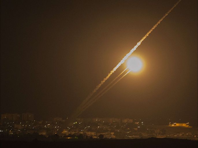 A picture taken from the southern Israeli Gaza border shows rockets being fired from the Gaza strip into Israel, on July 12, 2014. The world implored Israel and Hamas on July 12 to end hostilities as warplanes pounded Gaza for a fifth straight day, killing at least 30 Palestinians, and militants replied with rockets
