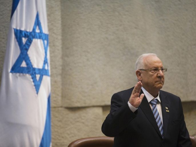 Incoming Israeli President Reuven Rivlin is sworn in during a ceremony at the Knesset, Israel's parliament, in Jerusalem, Thursday, July 24, 2014. Nobel Peace Prize laureate Shimon Peres ended his term as president of Israel on Thursday — a man who symbolizes hopes for peace capping a seven-decade public career amid the brutal reality of war. Peres handed the ceremonial but high-profile presidency over to Reuven Rivlin, a legislator from the hawkish Likud Party. (AP Photo/Ronen Zvulun, Pool)