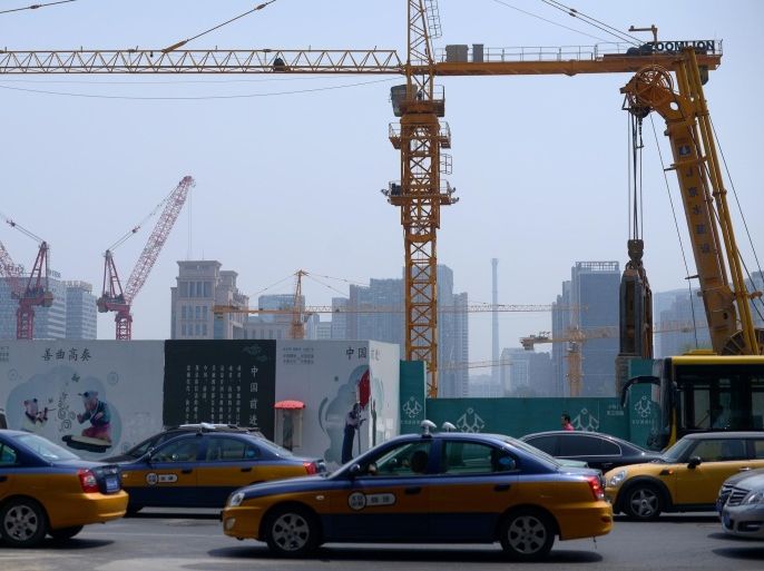 This picture taken on May 30, 2014 shows a construction site in Beijing. Home prices in major Chinese cities posted their first monthly decline in nearly two years in May, an independent survey showed May 30, providing new evidence the once red-hot market is losing steam. AFP PHOTO / WANG ZHAO