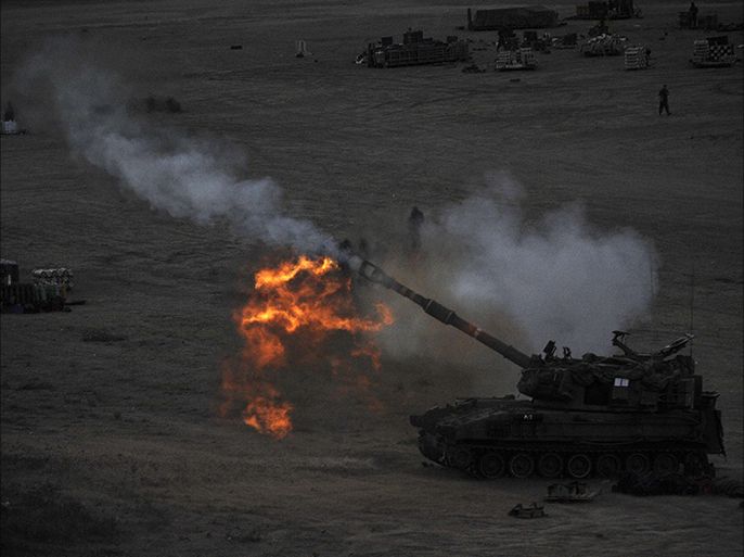 n Israeli tank fires a 155mm shell towards targets in the Gaza Strip from their position near Israel's border with the Palestinian enclave on July 23, 2014