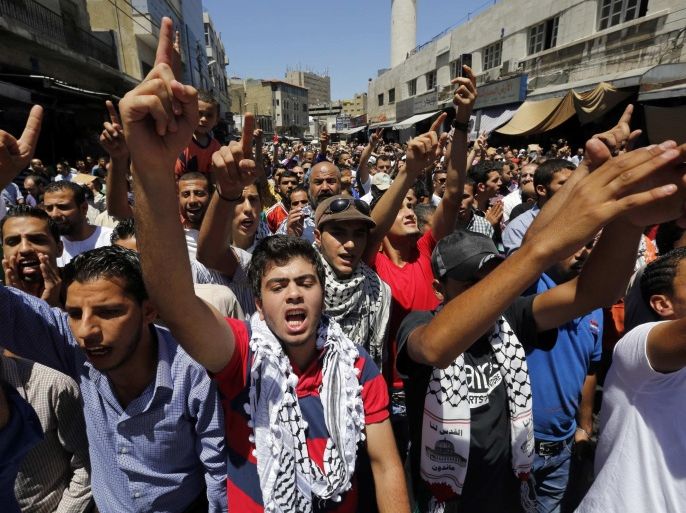 Protesters from the Islamic Action Front and other opposition parties shout slogans against Israel during a demonstration calling for an end to Israeli air strikes in the Gaza Strip, after Friday prayers in Amman July 18, 2014. REUTERS/Muhammad Hamed (JORDAN - Tags: POLITICS CIVIL UNREST CONFLICT RELIGION)