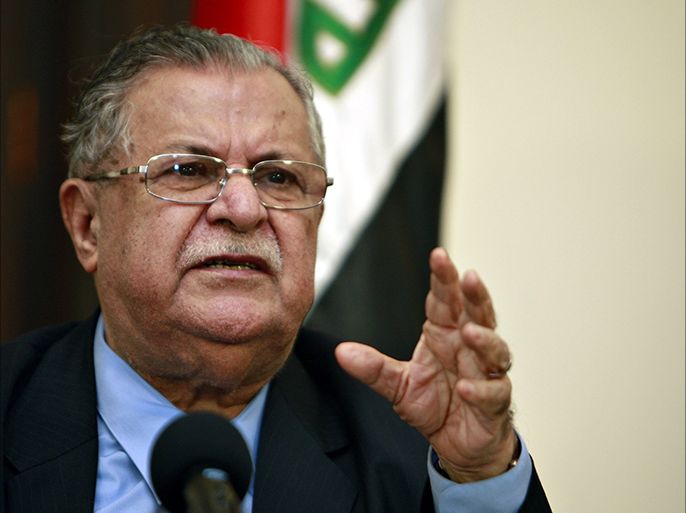 Baghdad, -, IRAQ : (FILES) - A file picture taken on March 02, 2009 shows Iraqi President Jalal Talabani speaking during a joint press conference in Baghdad. Talabani, who has been in Germany for medical treatment since December 2012, will return home on July 19, 2014, his party said in a statement on today. "President Talabani is coming home on Saturday July 19 after receiving successful health treatment in brotherly Germany," the Patriotic Union of Kurdistan statement said. AFP PHOTO / ALI AL-SAADI