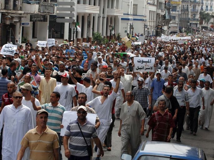Thousands of people march in the streets of Algiers, Algeria, as they protest against Israel's attack on Gaza, Friday, July 25, 2014. Thousands pro-Palestinian protesters attended a peaceful demonstration in Algiers demanding a halt to the military Israeli action in Gaza. (AP Photo/Sidali Djarboub)