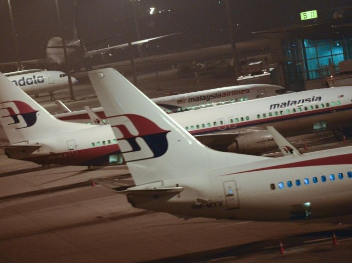 Malaysia Airlines planes are parked at Kuala Lumpur International Airport in Sepang, Malaysia, Thursday, July 18, 2013. A Malaysia Airlines flight with nearly 300 people aboard crashed over eastern Ukraine near the Russian border on Thursday, the Ukraine government and a regional European aviation official reported, Thursday, and the Interfax news agency said it had been shot down.(AP Photo/Joshua Paul)