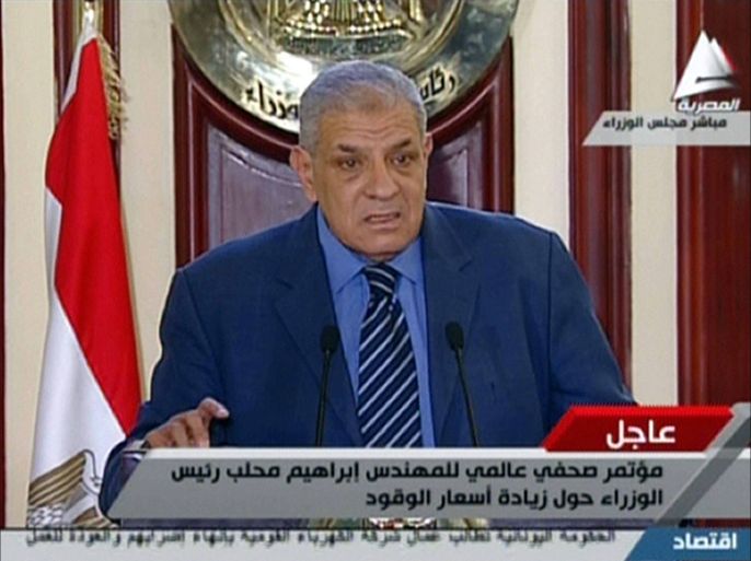 An image grab taken from Egyptian state TV on July 5, 2014, shows shows Egypt's Prime Minister Ibrahim Mahlab delivering a speech in Cairo. Egypt has drastically raised fuel prices overnight to tackle a bloated subsidy system, in a potentially unpopular move that might blow back on newly elected President Abdel Fattah al-Sisi. AFP PHOTO / EGYPTIAN TV == RESTRICTED TO EDITORIAL USE - MANDATORY CREDIT "AFP PHOTO / EGYPTIAN TV" - NO MARKETING NO ADVERTISING CAMPAIGNS - DISTRIBUTED AS A SERVICE TO CLIENTS