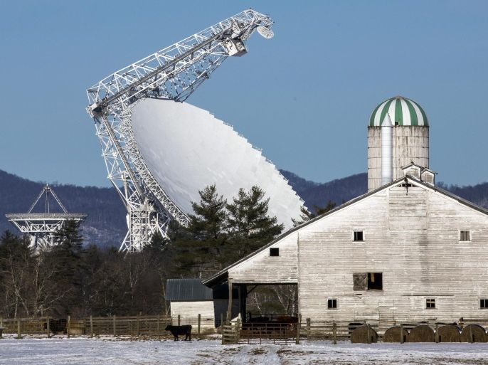 A photograph made available on 31 January 2014 shows the Robert C. Byrd Green Bank Telescope (C), the largest steerable radio telescope in the world, in Green Bank, West Virginia, USA, 30 January 2014. To protect the observatory from radio interference, the Federal Communications Commission designated 13,000 miles (20,921 km) surrounding the facility as a National Radio Quiet Zone, where wireless communications such as radio, cell phone, and wi-fi are severely restricted.