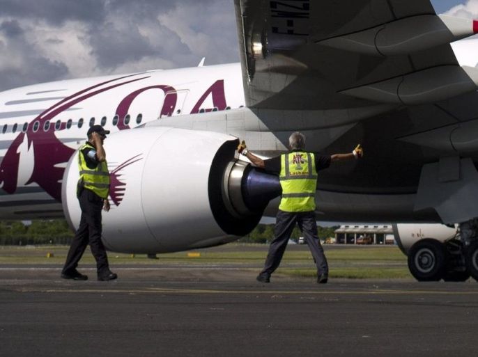 A Qatar Airways Airbus Industrie A350 aircraft is reversed into its parking position at the 2014 Farnborough International Airshow in Farnborough, southern England July 13, 2014. REUTERS/Kieran Doherty (BRITAIN - Tags: TRANSPORT SOCIETY)