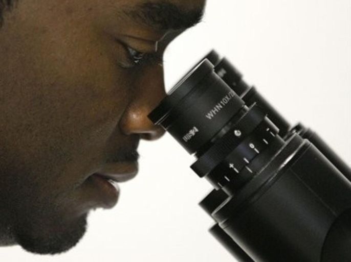 In this Oct. 19, 2011 photo, Christopher Smith, a doctoral student in biomedical engineering, looks at stem cell samples through an inverted microscope in a lab at the Johns Hopkins University medical campus in Baltimore. Despite robust hiring in the fields of science, technology, engineering and math, the percentage of African-Americans entering such careers has fallen during the last decade. In Smith's field of biological and biomedical sciences, where 6,957 PhDs were awarded in 2009, only 88 went to black men.
