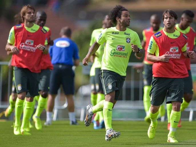 TERESOPOLIS, BRAZIL - JUNE 26: (L-R) Henrique, Marcelo and Maxwell in action during a training session of the Brazilian national football team at the squad's Granja Comary training complex, on June 26, 2014 in Teresopolis, 90 km from downtown Rio de Janeiro, Brazil.
