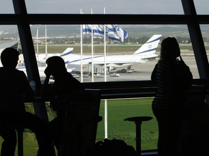People sit inside Israel's Ben-Gurion International Airport near Tel Aviv in a January 5, 2010 file photo. U.S. air carriers Delta Air Lines and US Airways, a unit of American Airlines Group , on Tuesday said they have halted flights to Israel to ensure passenger safety. Delta said in a statement that it has suspended operations "until further notice" to and from Ben Gurion International Airport in Tel Aviv and its hub at New York's John F. Kennedy Airport. The Atlanta-based carrier said it was doing so in coordination with the Federal Aviation Administration "to ensure the safety of our customers and employees."REUTERS/Ronen Zvulun/files (ISRAEL - Tags: TRANSPORT CIVIL UNREST)