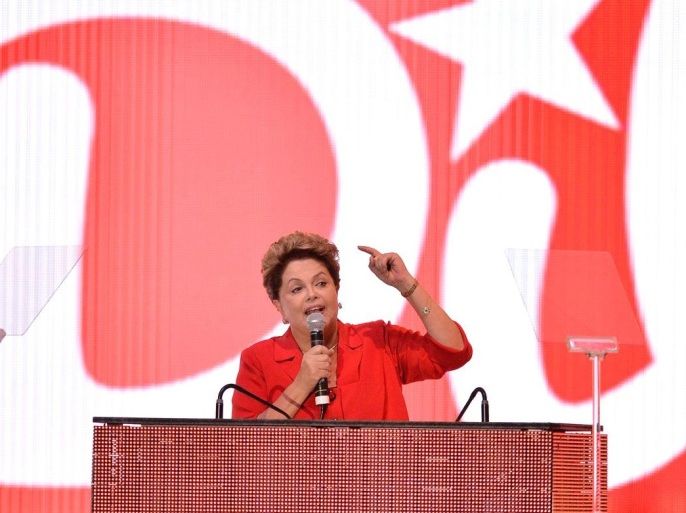 Brazilian President Dilma Rousseff speaks during the Workers Party (PT) convention in Brasilia, on June 21, 2014. The PT officially confirmed Rousseff and Vice President Michel Temer as their presidential and vice presidential candidates respectively. AFP PHOTO / Edilson RODRIGUES