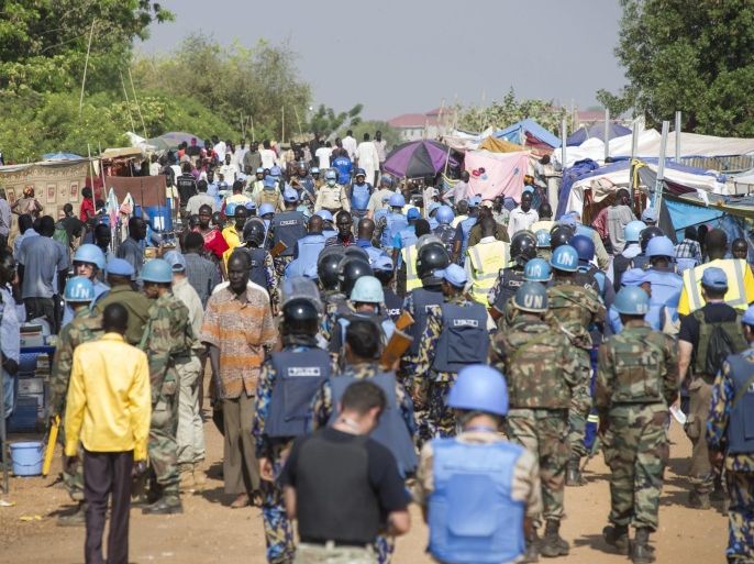 A handout picture provided by the United Nations' UNMISS mission on 18 January 2014 shows soldiers of the UNMISS and UNPOL missions conducting a security sweep of the IDP (Internally Displaced Person) Camp in Tom-ping, Juba, South Sudan, 14 January 2014. The operation was done in order to clear the camp of any weapons and contraband including Military and Police Uniforms. The South Sudan conflict has killed more than 1,000 people, according to the United Nations. Some estimates put the number of casualties at up to 10,000. More than 400,000 people are estimated to have fled their homes. EPA/ISAAC ALEBE AVORO LU'BA / UN PHOTO / HANDOUT