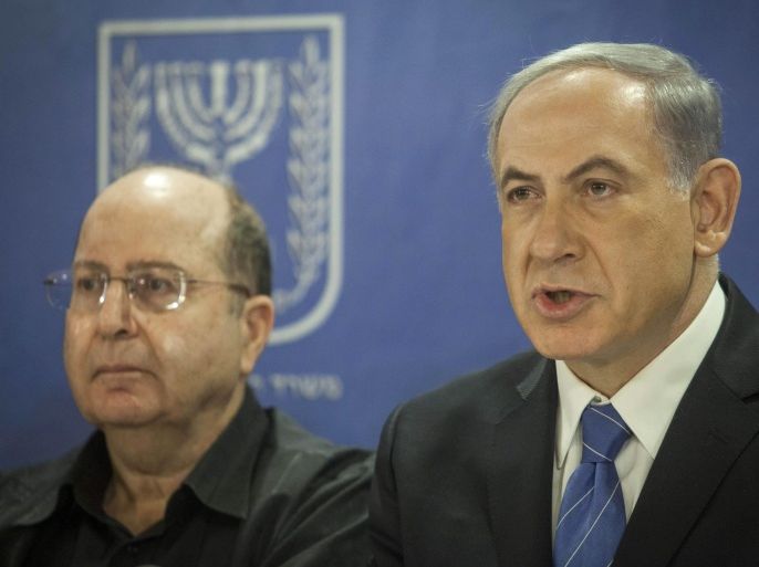 Israeli Defense Minister Moshe Ya'alon (L) and Israeli Prime Minister Benjamin Netanyahu (R) attend a cabinet meeting at the Defense Ministry in Tel Aviv, Israel, 31 July 2014. Israel will accept no humanitarian truce that prevents its soldiers from completing the job of destroying tunnels dug by militants throughout Gaza that could be used for attacking Israel, Netanyahu said on 31 July.