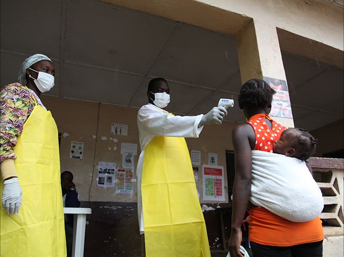 A Liberian nurse tests the temperature of Liberians as part of a health drive to curb the spread of the deadly Ebola virus at the Clay Junction, Bomi County, Liberia 13 August 2014. According to statistics from the World Health Organisation (WHO) over 1000 have died from Ebola in West Africa. WHO has issued a statement suggesting it was ethical to now use untested drugs on patients infected with the Ebola virus due to the scale of the outbreak. The first Zmapp test drugs for Ebola have arrived in Liberia one of the hardest hit by the virus. EPA/AHMED JALLANZO