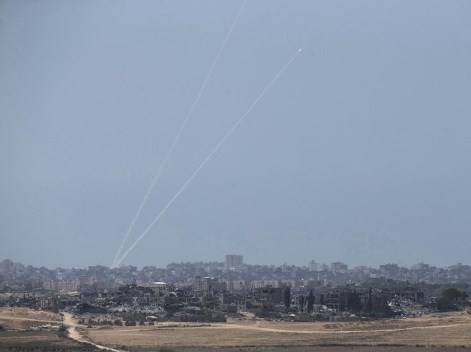 Smoke trails are seen as rockets are launched from the Gaza Strip towards Israel August 20, 2014. An Israeli air strike in Gaza killed the wife and infant son of Hamas's military leader, Mohammed Deif, the group said, calling it an attempt to assassinate him after a ceasefire collapsed. Palestinians launched more than 100 rockets, mainly at southern Israel, with some intercepted by the Iron Dome anti-missile system, the military said. No casualties were reported on the Israeli side. REUTERS/Baz Ratner (ISRAEL - Tags: POLITICS CIVIL UNREST CONFLICT)