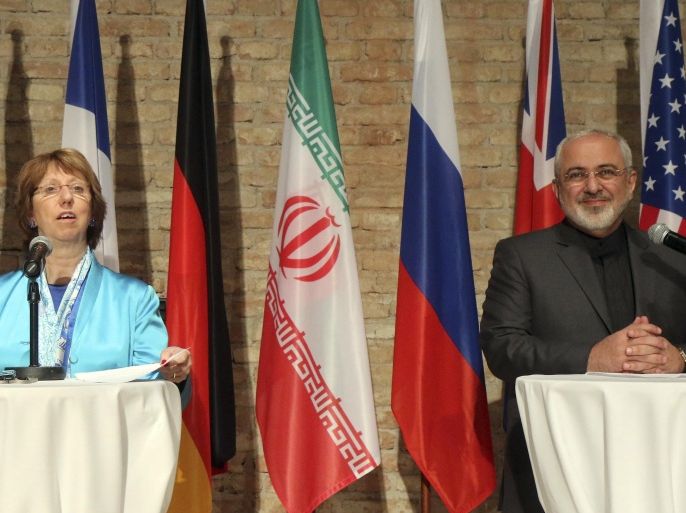 European foreign policy chief Catherine Ashton, left, and Iranian Foreign Minister Mohammad Javad Zarif, right, address the media after closed-door nuclear talks in Vienna, Austria, Saturday, July 19, 2014. (AP Photo/Ronald Zak)