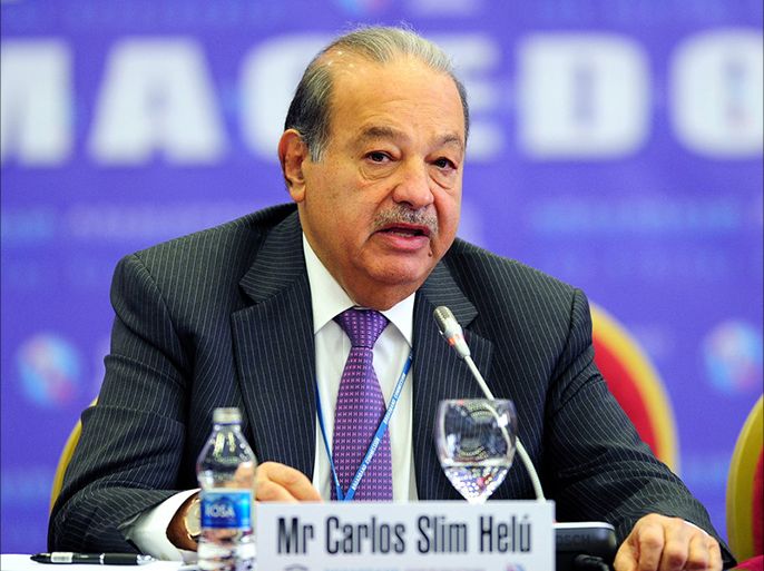 epa03817685 (FILES) A file picture dated 02 April 2012 shows Carlos Slim Helu, Mexican business magnate and philanthropist attending the fifth meeting of the Broadband Commission for Digital Development organized by Macedonian government in Ohrid, The Former Yugoslav Republic of Macedonia. Slim announced 09 August 2013 an offer to takeover Dutch mobile phone giant Royal KPN, in an attempt to expand his telecom empire into Europe. Slim's America Movil, headquartered in Mexico City, said in a statement that it plans to buy a majority stake in KPN for 2.40 euros per share. It already owns 30 per cent of the company. EPA/GEORGI LICOVSKI