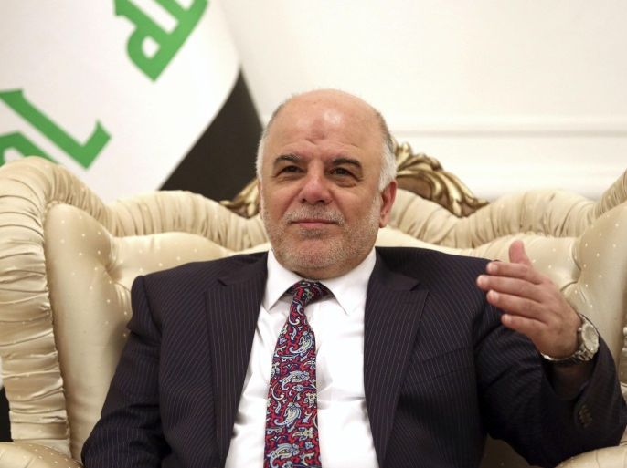 Iraq's Prime Minister-designate Haider al-Abadi smiles during a meeting German's Foreign Minister Frank-Walter Steinmeier in Baghdad August 16, 2014. Steinmeier arrived in Baghdad on Saturday for talks with Iraqi officials on what could be done to help the country in its fight against insurgents of the Islamic State. REUTERS/Hadi Mizban/Pool (IRAQ - Tags: CIVIL UNREST POLITICS CONFLICT)
