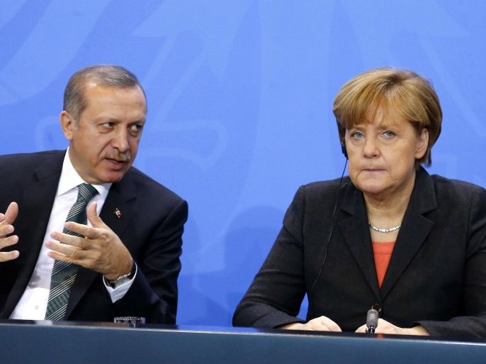 File photo of German Chancellor Angela Merkel and Turkey's Prime Minister Tayyip Erdogan addressing the media after talks in Berlin February 4, 2014. Germany's foreign intelligence agency has been spying on Turkey for nearly four decades, Focus magazine said August 23, 2014, in a report which could raise tensions further between the NATO allies. The magazine also cited government sources as saying the BND intelligence agency's current mandate to monitor Turkish political and state institutions had been agreed by a government working group. That included representatives of the chancellor's office, the defence, foreign and economy ministries. A spokesman for the German government declined to comment on the report. REUTERS/Tobias Schwarz/Files (GERMANY - Tags: POLITICS)