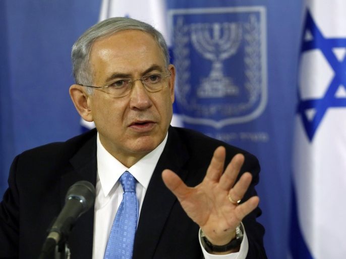 Israeli Prime Minister Benjamin Netanyahu gestures as he speaks during a joint press conference with Defense Minister (unseen) at the defense ministry in the coastal city of Tel Aviv on August 2, 2014. Israel will continue its military campaign in the Gaza Strip for as long as needed and with as much force as necessary,Netanyahu said. AFP PHOTO/GALI TIBBON