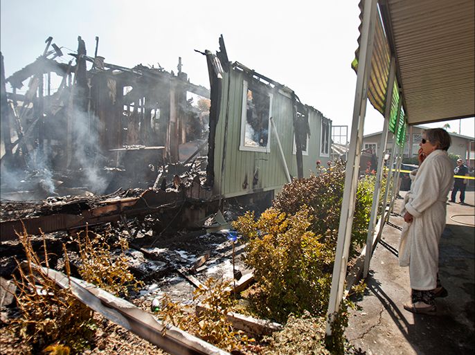 Nola Rawlins 83, surveys her home, that was destroyed by a fire at the Napa Valley mobile home park after a 6.1 magnitude earthquake hit the San Francisco Bay Area, in Napa, California, USA, 24 August 2014. More than 70 people were sent to hospital with injuries and power outages darkened multiple cities in northern California after a 6.1-magnitude earthquake struck early on 24 August. The United States Geological Survey (USGS) said the earthquake struck at 3:20 am (1020 GMT) at a depth of 10.8 kilometres. It was located nine kilometres south-west of the Napa wine region, and 81 kilometres north of San Francisco. EPA/PETER DaSILVA