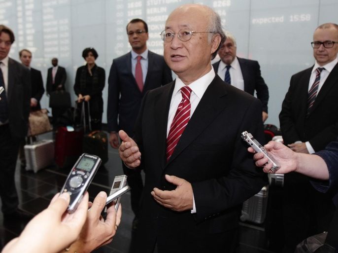 International Atomic Energy Agency (IAEA) Director General Yukiya Amano talks to the media as he arrives at Vienna's airport August 18, 2014. Iran has begun implementing nuclear transparency measures ahead of an August 25 deadline agreed with the United Nations atomic watchdog, the IAEA, Amano said on Monday. REUTERS/Heinz-Peter Bader (AUSTRIA - Tags: POLITICS ENERGY)