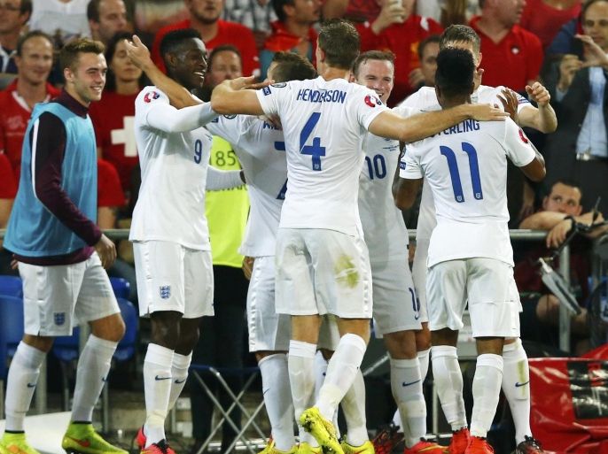England's Danny Welbeck (2L) celebrates with team mates after scoring a goal against Switzerland during their Euro 2016 qualifying soccer match at the Sankt Jakob-Park stadium in Basel September 8, 2014. REUTERS/Denis Balibouse (SWITZERLAND - Tags: SPORT SOCCER)