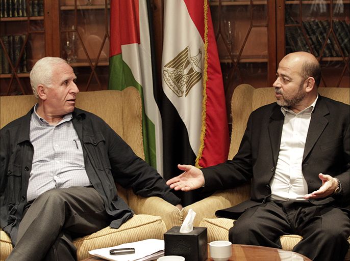 epa04415419 Member of Palestinian Fatah party, Azzam al-Ahmad (L), meets with Hamas politburo member Musa Abu Marzouk (R) at a hotel in Cairo, Egypt, 24 September 2014. Media reports state indirect Israeli-Palestinian negotiations on a long-term Gaza truce started in Cairo on 23 September, days before expiry of a one-month truce that temporarily ended 50 days of deadly cross-border fighting. Fatah and Hamas are also holding separate Egyptian-mediated talks in Cairo in a bid to reach a unified stance on Gaza between the two Palestinian rivals EPA/KHALED ELFIQI