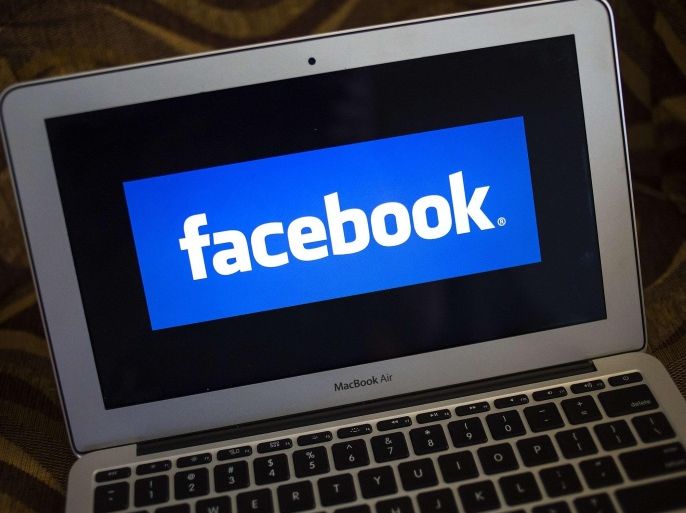 A Facebook logo is shown on a notebook in Ventura, California in this December 21, 2013 file photo. Facebook has more than 400 employees in Seattle, up from 125 only two years ago, vastly outstripping the social network's overall growth. It recently took over a second floor in its rented offices to handle the overflow, and is starting to fill a third. REUTERS/Eric Thayer/Files (UNITED STATES - Tags: BUSINESS LOGO)