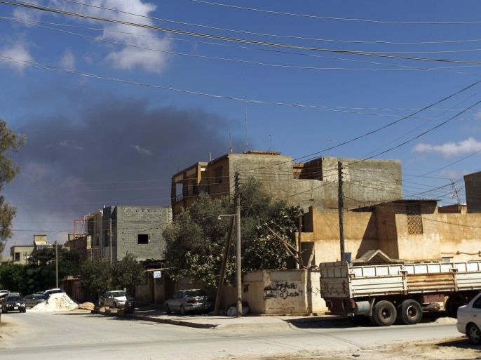 Smoke rises following an air strike in Libya's eastern coastal city of Benghazi on September 1, 2014. Libya's toothless outgoing government admitted from its safe refuge in the east of the country that it has in effect lost control of Tripoli to armed militias. AFP PHOTO/ ABDULLAH DOMA