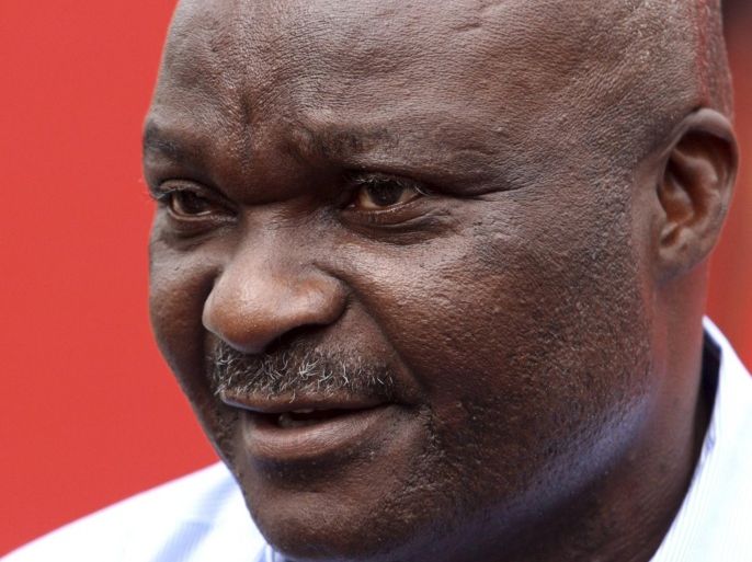 Former Cameroon soccer player Roger Milla attends a news conference during his meeting with young Kenyan players in the capital Nairobi, May 10, 2010.