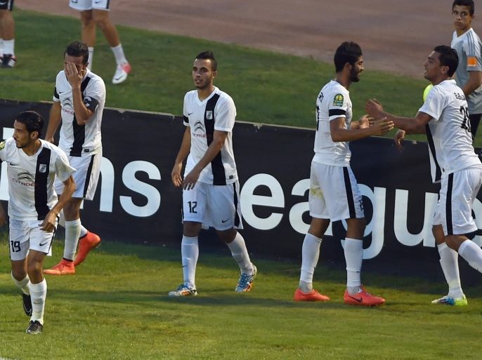 Tunisia's CS Sfaxien players celebrate after Ferjani Sassi (2ndR) scored a goal against Libya's Al-Ahly Benghazi during their CAF Champions League football match on August 8, 2014 at the Zouiten stadium in Tunis. AFP PHOTO/ FETHI BELAID